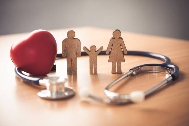a stethoscope, a heart and a family on a table